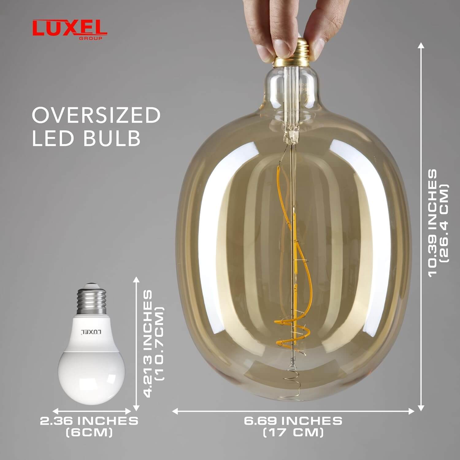 Oversized Ellipse 170 LED bulb in hand with measurements showing its large size.