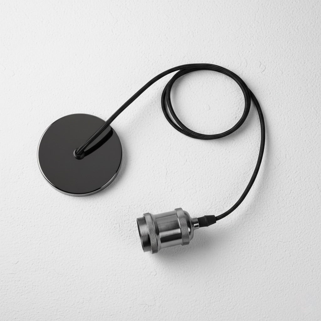 Black and silver lamp components on a light gray background