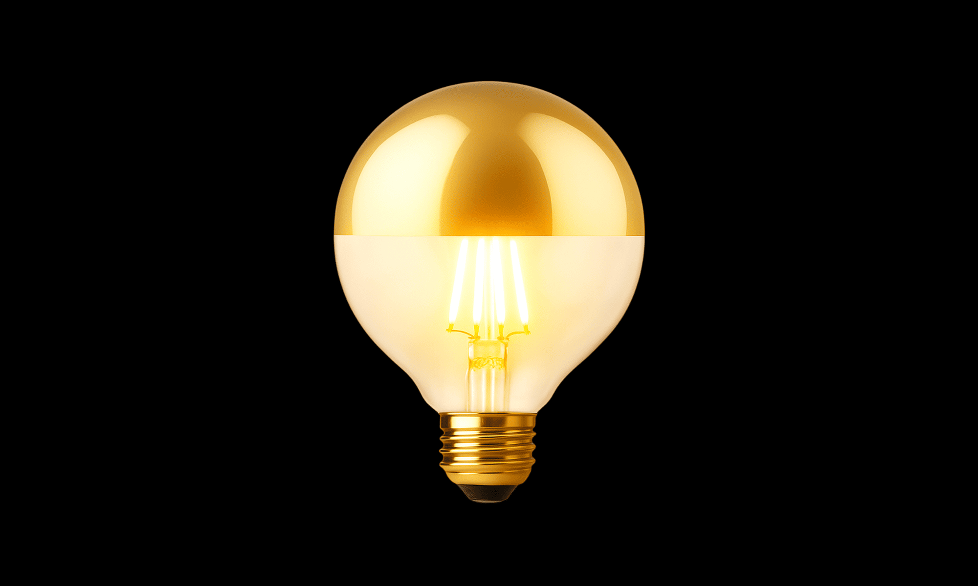Gold light bulb on a black background