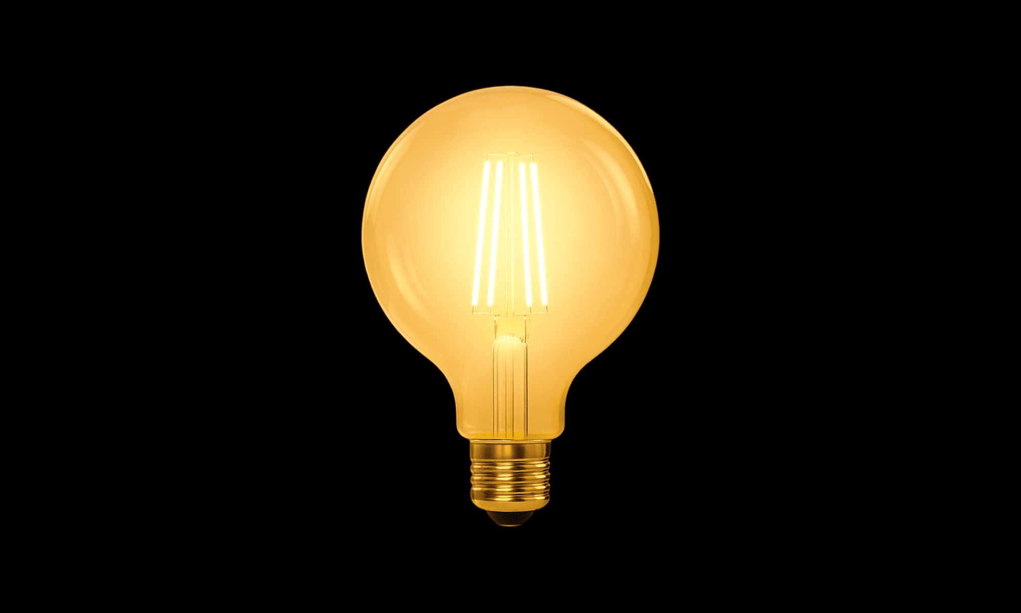 Vintage-style light bulb on a black background