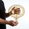 Vintage-inspired oversized amber LED bulb