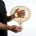 Vintage-inspired oversized amber LED bulb