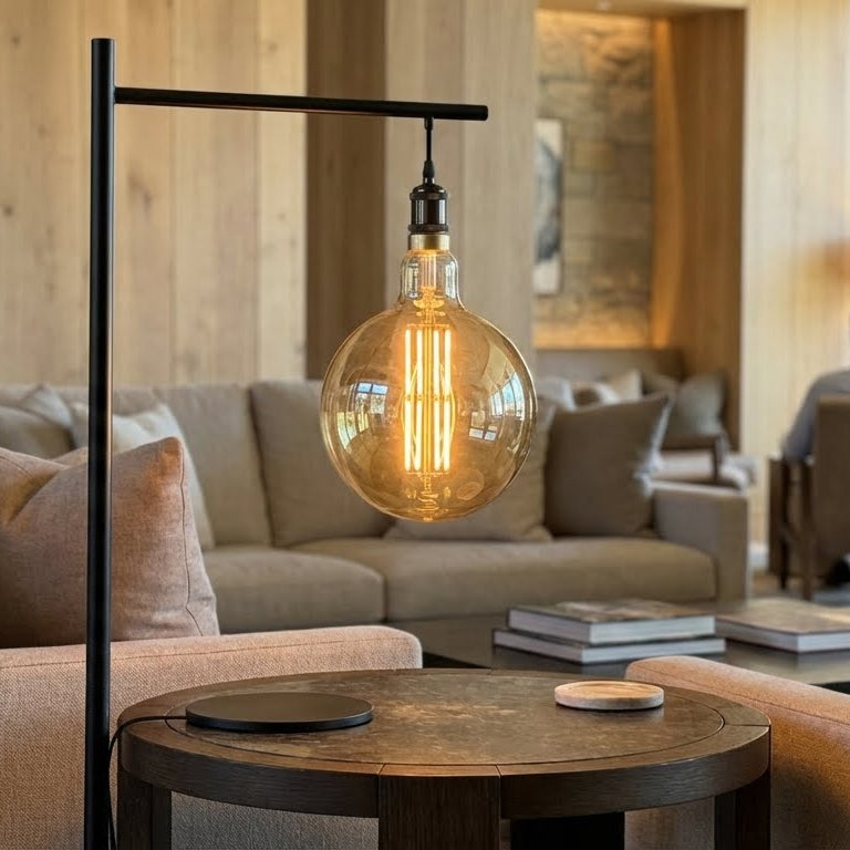 Modern living room with a floor lamp and round table.