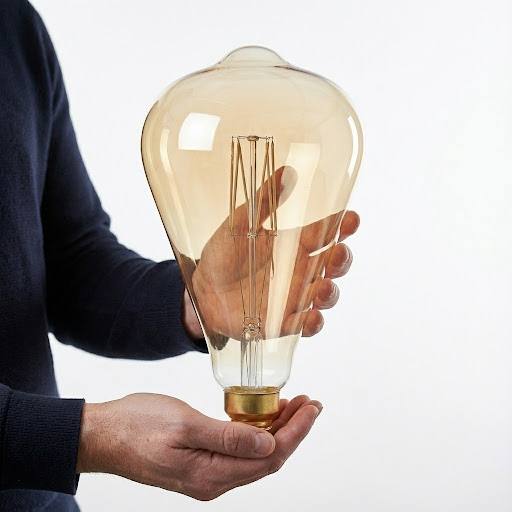 Large statement bulb glowing with a golden light