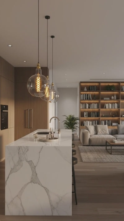 Vintage-style light bulbs hanging from the ceiling in a softly blurred room setting.