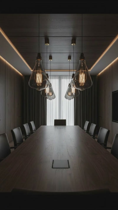 Vintage-style light bulbs hanging from the ceiling in a softly blurred room setting.